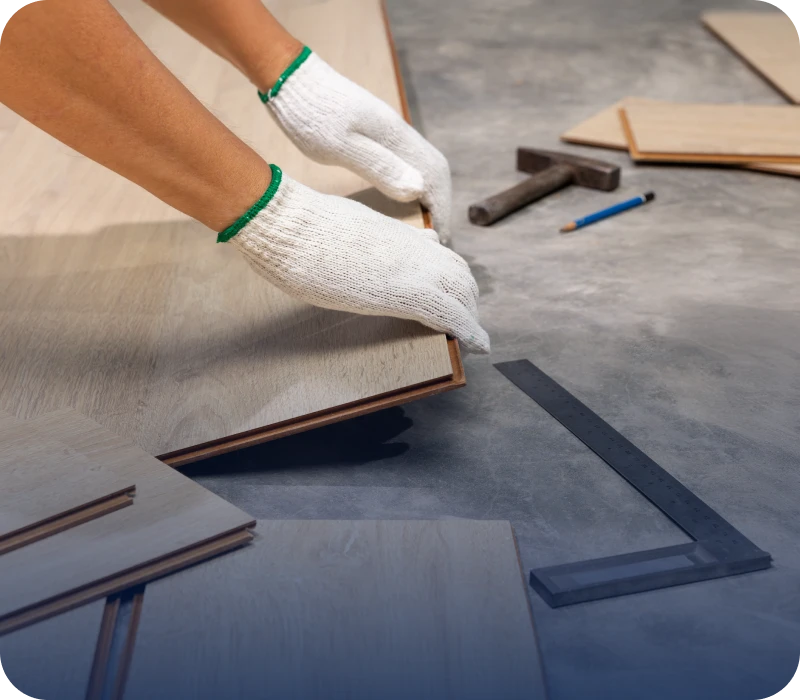 Worker fitting wooden planks together