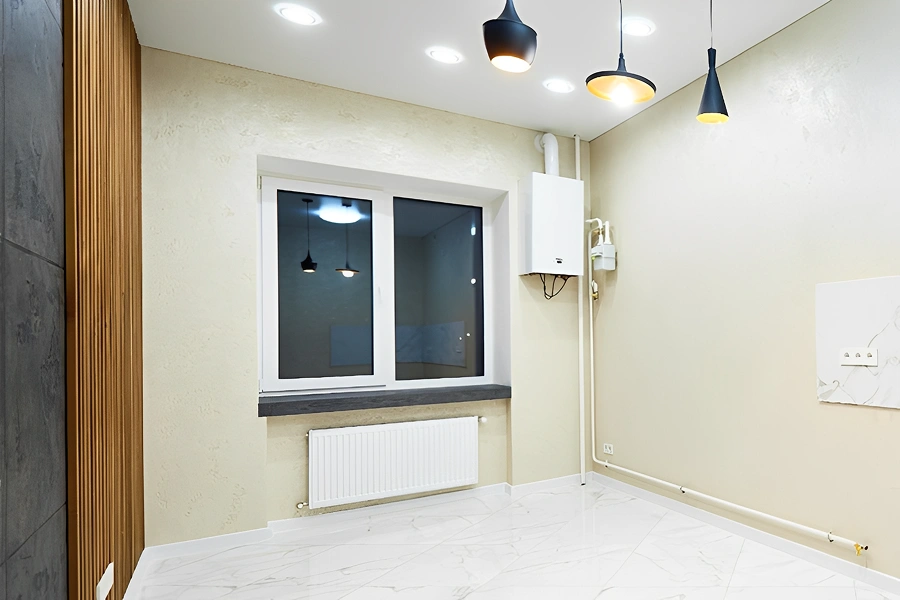 Modern empty room with window and lights.